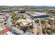 Aerial view of a commercial area with covered seating, desert landscaping, and mountain views at 1 Easy St # 6, Carefree, AZ 85377