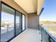 Spacious balcony featuring glass railings and sliding glass doors with scenic neighborhood views at 1 Easy St # 6, Carefree, AZ 85377