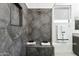 Contemporary bathroom with geometric tile shower, built-in bench, and convenient towel storage niche at 1 Easy St # 6, Carefree, AZ 85377