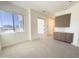 Bright bedroom with neutral carpet, stylish built-ins, and a large window at 1 Easy St # 6, Carefree, AZ 85377