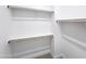 Walk-in closet with built-in shelving and rods for storage at 1 Easy St # 6, Carefree, AZ 85377
