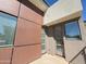 Unique exterior corner of the building featuring metal accents, glass windows, and a private walk out door at 1 Easy St # 6, Carefree, AZ 85377