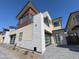 Exterior shot of a modern home with multi-car parking, large windows, and a small balcony at 1 Easy St # 6, Carefree, AZ 85377