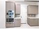 Modern kitchen with stainless steel appliances, gray cabinetry, and a built-in oven and microwave at 1 Easy St # 6, Carefree, AZ 85377
