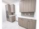 Modern kitchen with gray cabinets, stainless steel appliances, including a built-in oven and microwave combo at 1 Easy St # 6, Carefree, AZ 85377