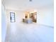 Open concept living space with tile flooring, a view of the kitchen, and natural light coming from the front door at 1 Easy St # 6, Carefree, AZ 85377