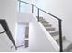 Bright staircase with carpeted steps and a modern metal railing at 1 Easy St # 6, Carefree, AZ 85377