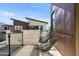 Modern balcony with contemporary furniture, a sleek glass railing, and a building view at 1 Easy St # 7, Carefree, AZ 85377