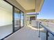 Spacious balcony with glass railings, offering views of the surrounding landscape and parking area at 1 Easy St # 7, Carefree, AZ 85377