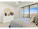 Bright bedroom featuring a comfortable bed, a stylish dresser, and balcony access with scenic views at 1 Easy St # 7, Carefree, AZ 85377