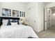 Cozy bedroom featuring a comfortable bed, modern art, and closet doors at 1 Easy St # 7, Carefree, AZ 85377