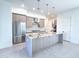 Bright and modern kitchen with stainless steel appliances, granite countertops, and ample cabinet space at 1 Easy St # 7, Carefree, AZ 85377