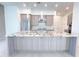 Bright, open kitchen with modern cabinets, stainless appliances, and a large island at 1 Easy St # 7, Carefree, AZ 85377