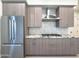 Modern kitchen with stainless steel refrigerator and gas cooktop at 1 Easy St # 7, Carefree, AZ 85377