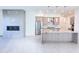 Spacious living room and kitchen with modern fireplace and stainless steel appliances at 1 Easy St # 7, Carefree, AZ 85377