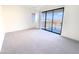 Spacious living area with large sliding glass doors opening to a balcony with scenic views at 1 Easy St # 7, Carefree, AZ 85377