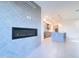 Bright living room with a modern fireplace and a seamless transition into the stylish kitchen at 1 Easy St # 7, Carefree, AZ 85377