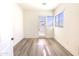 Bright office with plank floors, large windows, and a glass-paned door, creating an inspiring workspace at 1 Easy St # 7, Carefree, AZ 85377