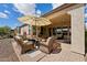 Inviting covered patio with comfortable seating and outdoor dining area perfect for entertaining at 12915 W Lone Tree Trl, Peoria, AZ 85383