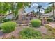 Beautifully landscaped Residence Center with stone facade and manicured bushes, offering a welcoming entrance at 14145 N 92Nd St # 2004, Scottsdale, AZ 85260