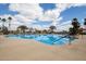 Large outdoor pool surrounded by lounge chairs and landscaping at 15696 W Roanoke Ave, Goodyear, AZ 85395