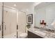 Bright bathroom featuring a glass shower enclosure, modern fixtures, and a granite vanity at 15815 W Kendall St, Goodyear, AZ 85338