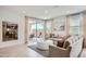 Inviting living room featuring neutral tones, stylish decor, and sliding doors leading to an outdoor patio area at 15815 W Kendall St, Goodyear, AZ 85338