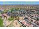 Expansive community aerial shot with golf course, tennis courts, pools, fitness center, and Sonoran Plaza at 16100 W Galleria Ln, Surprise, AZ 85374