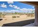 Relaxing back patio view of the desert landscaping and green golf course at 16100 W Galleria Ln, Surprise, AZ 85374