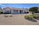 Spacious backyard featuring a covered patio and a desert landscape, offering a private outdoor retreat at 16100 W Galleria Ln, Surprise, AZ 85374