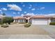 Charming single-story home with a well-manicured front yard, creating a welcoming and inviting curb appeal at 16100 W Galleria Ln, Surprise, AZ 85374