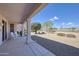 Cozy covered patio offering a serene outdoor space, perfect for relaxing and enjoying the surrounding views at 16100 W Galleria Ln, Surprise, AZ 85374