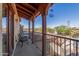 Balcony with wrought iron railing, and views of the surrounding neighborhood and mountains at 17975 W Agave Rd, Goodyear, AZ 85338