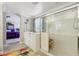 Bathroom featuring a glass door shower, soaker tub, and colorful rug at 18504 W Maui Ln, Surprise, AZ 85388