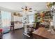 Bright craft room with hardwood floors, abundant storage, ceiling fan, and natural light at 18504 W Maui Ln, Surprise, AZ 85388