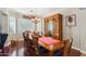 Formal dining room with chandelier and large wood hutch at 18504 W Maui Ln, Surprise, AZ 85388