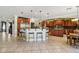 Bright kitchen with breakfast bar boasts ample counter space and a functional layout, great for entertaining at 18504 W Maui Ln, Surprise, AZ 85388