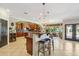 Spacious open kitchen with granite countertop bar, island, and stainless appliances at 18504 W Maui Ln, Surprise, AZ 85388