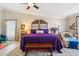 Cozy main bedroom showcasing carpet floors, a bench, and a contemporary ceiling fan at 18504 W Maui Ln, Surprise, AZ 85388