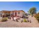 Cozy backyard patio with desert landscaping and outdoor seating at 201 S Greenfield Rd # 65, Mesa, AZ 85206