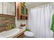 Cozy bathroom with decorative fixtures and a unique vanity cabinet at 201 S Greenfield Rd # 65, Mesa, AZ 85206