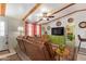 Bright living room featuring exposed beams, eclectic decor, and seamless flow to bedroom at 201 S Greenfield Rd # 65, Mesa, AZ 85206