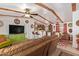 Spacious living room with wooden beams, fan, and open-concept design to the kitchen at 201 S Greenfield Rd # 65, Mesa, AZ 85206