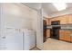 Laundry room featuring a full-size washer and dryer conveniently located off the kitchen at 20100 N 78Th Pl # 1013, Scottsdale, AZ 85255