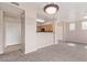 Spacious living room showcasing the kitchen, ceiling fan, and tile entryway at 20100 N 78Th Pl # 1013, Scottsdale, AZ 85255