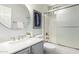 Well-lit bathroom with a vanity, round mirror and a shower-tub combination at 220 W Wood Dr, Chandler, AZ 85248