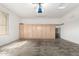 Spacious garage with ample storage cabinets and concrete floors at 220 W Wood Dr, Chandler, AZ 85248