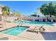 Community pool and jacuzzi with lounge chairs and shade for relaxing in the sun at 220 W Wood Dr, Chandler, AZ 85248