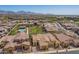 Community aerial view with mountain views, lush green spaces and mature trees enhancing the serene neighborhood setting at 23133 N 73Rd Pl, Scottsdale, AZ 85255