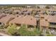 Aerial view showcases a well-maintained community with tile roofs and neat landscaping, highlighting the property's location at 23133 N 73Rd Pl, Scottsdale, AZ 85255